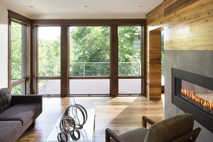 Room with stained-pine Andersen 400 Series picture and awning windows