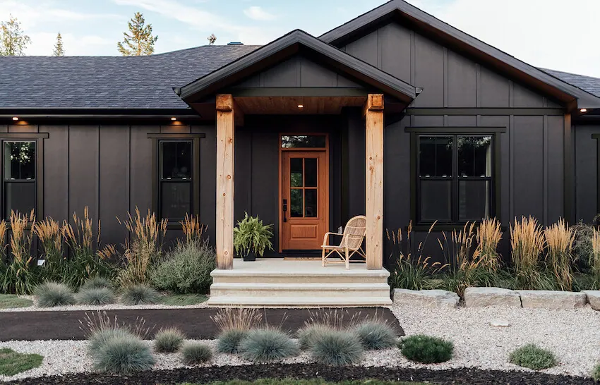 Single-story home clad in Iron Gray vertical board-and-batten siding
