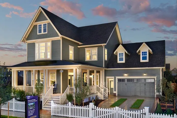 Two-story custom home exterior with multiple white Prime window configurations